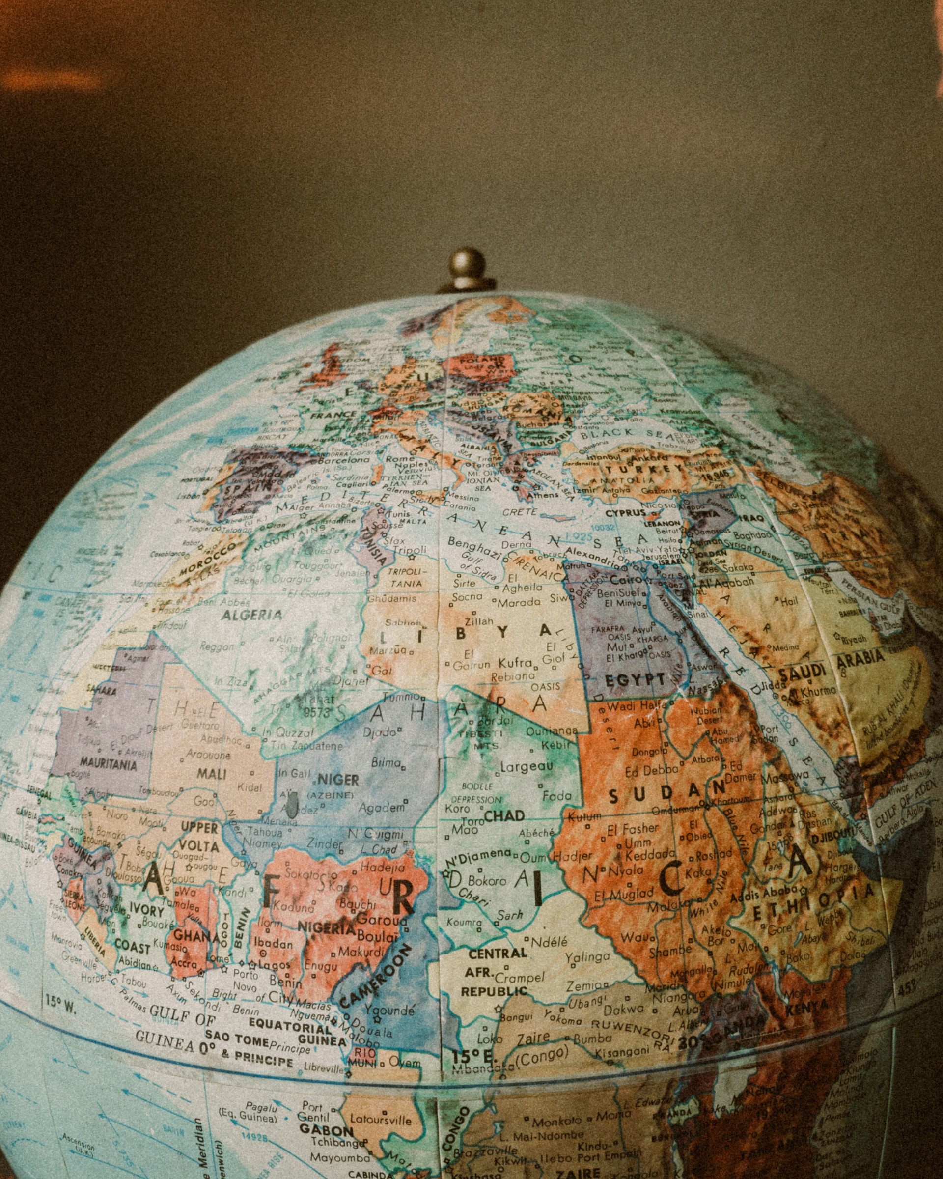 Blue and brown desk globe photo.